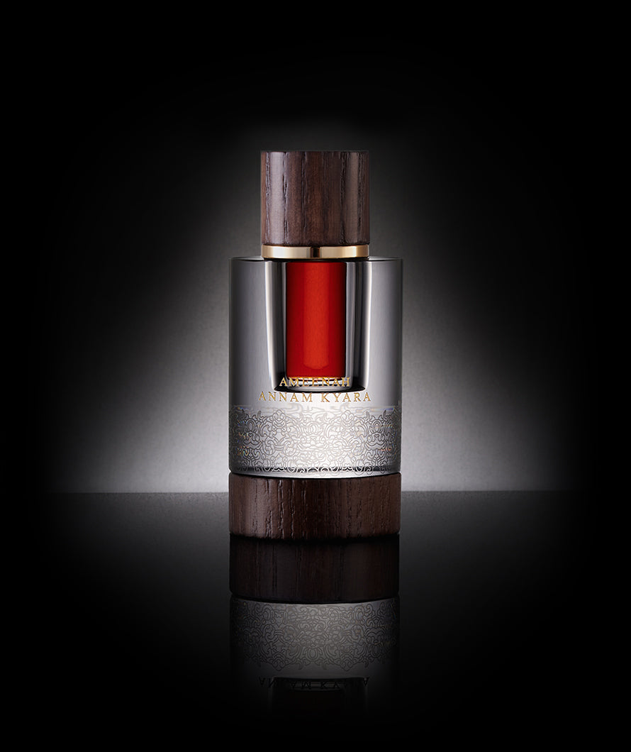 Close-up of Annam Kyara Dehn Al Oud bottle | a rare, woody and warm oud oil crafted from the finest agarwood, reflecting luxury and heritage in an elegant design.