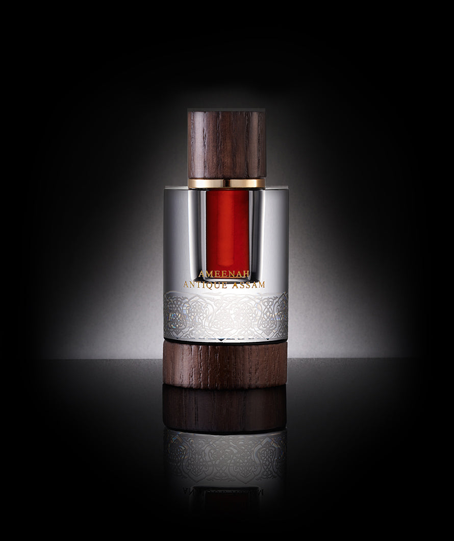 Close-up of Antique Assam Dehn Al Oud bottle a warm, earthy, and complex oud oil featuring honey, musk, nutty, and spicy notes, inspired by the cradle of oud in Assam’s pristine nature.