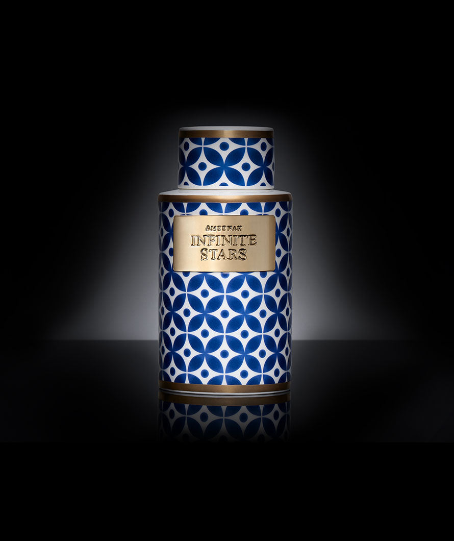 Close-up of Ameenah Infinite Stars incense vase , a luxurious oil-infused bakhoor with oud, rose, and amber.