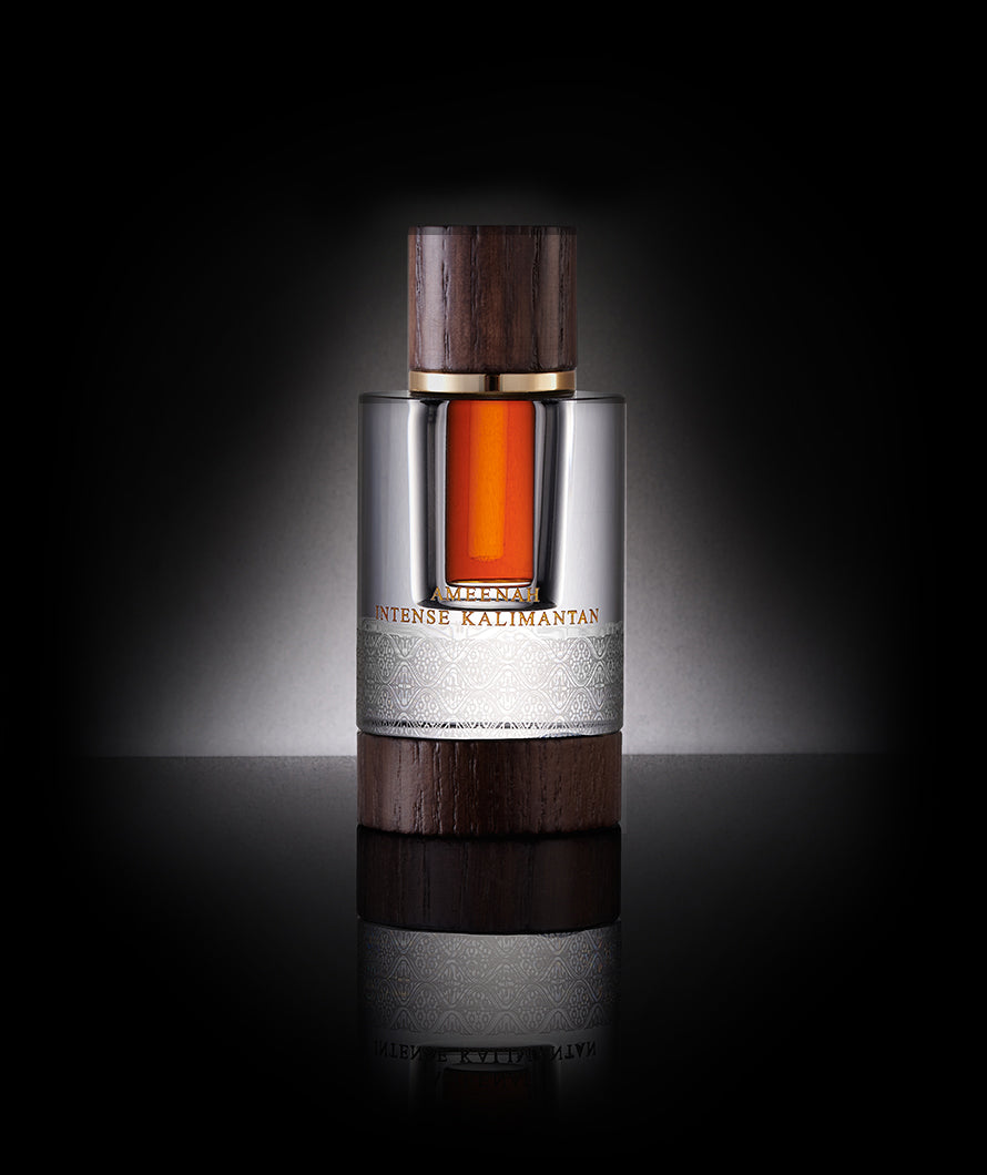 Close-up of Intense Kalimantan Dehn Al Oud bottle a leathery and woody oud oil with sweet vanilla notes, reflecting charisma, luxury, and refined taste.