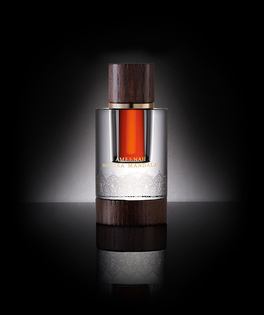 Close-up of Mantra Mandalay Dehn Al Oud bottle a floral and sweet oud oil with almond and musk notes, capturing harmony, imagination, and timeless elegance.