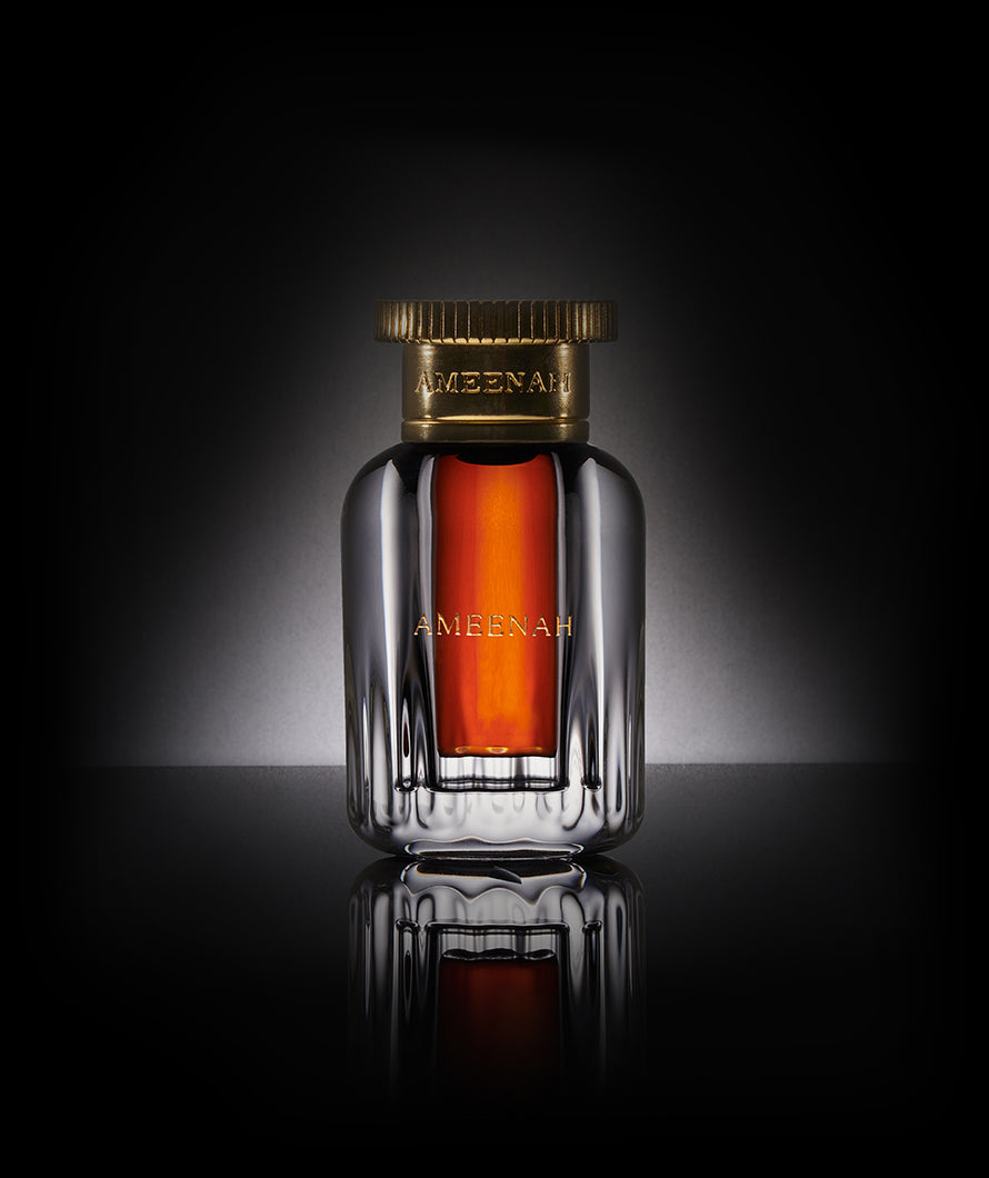 Close-up of Ameenah Dehn Al Oud perfume bottle from the Classical Oud Oil Collection, showcasing a luxurious amber and floral fragrance crafted from rare oud and honeyed notes.