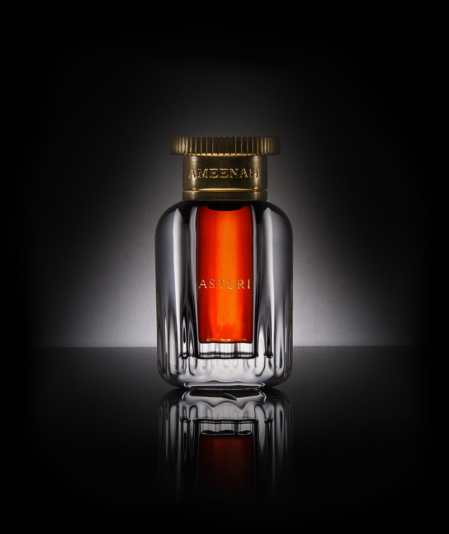Close-up of Asturi Dehn Al Oud bottle — a luxurious fruity and woody oud oil crafted from rare Cambodian Aquilaria Crassna, blending joy and serenity.