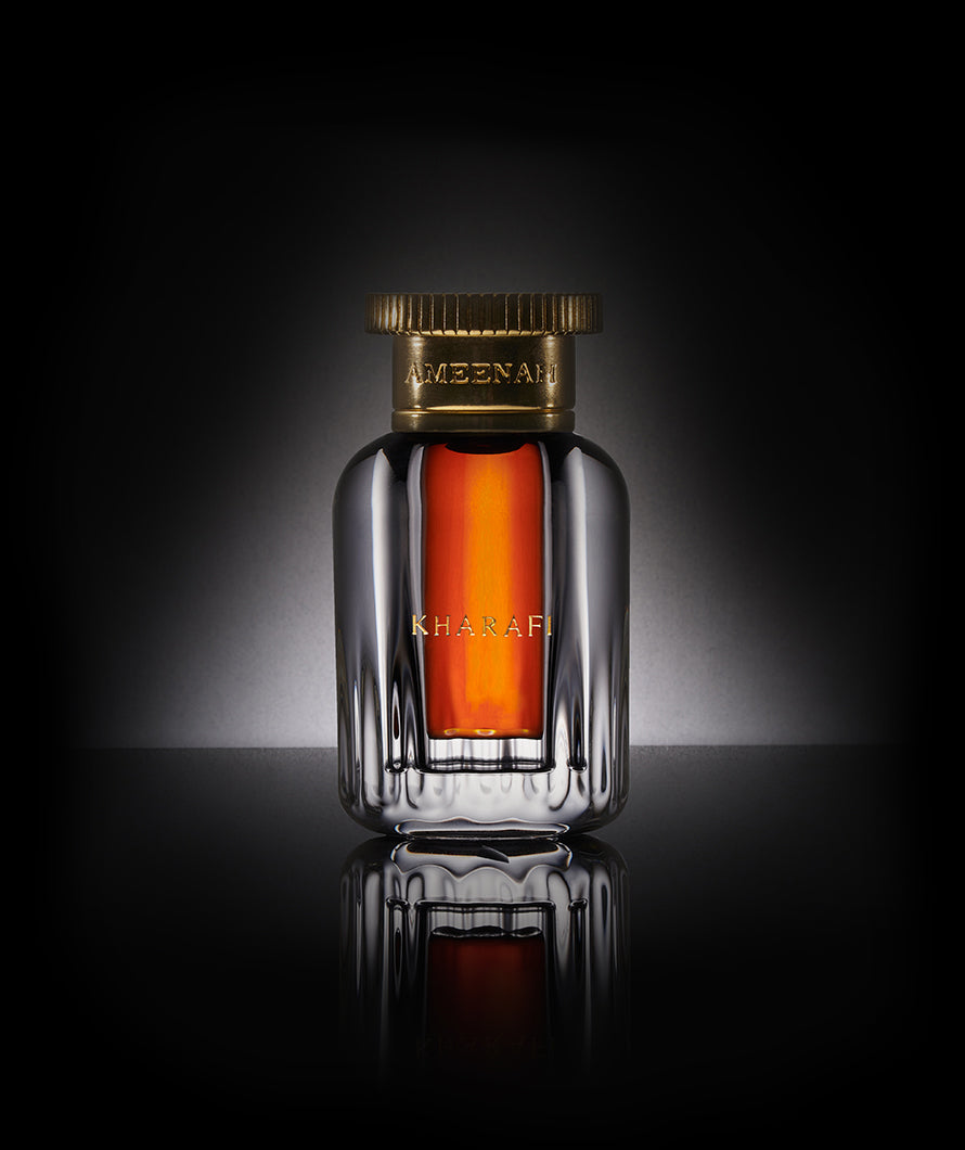 Close-up of Kharafi Dehn Al Oud bottle , a bold, woody, and spicy oud oil that embodies power and celebrates the legendary glory of Indian oud.