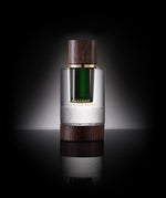 Close-up of Emerald Papuan Dehn Al Oud bottle  a fresh, green, tropical oud oil with citrus and floral notes, reflecting vitality, uniqueness, and global appeal.